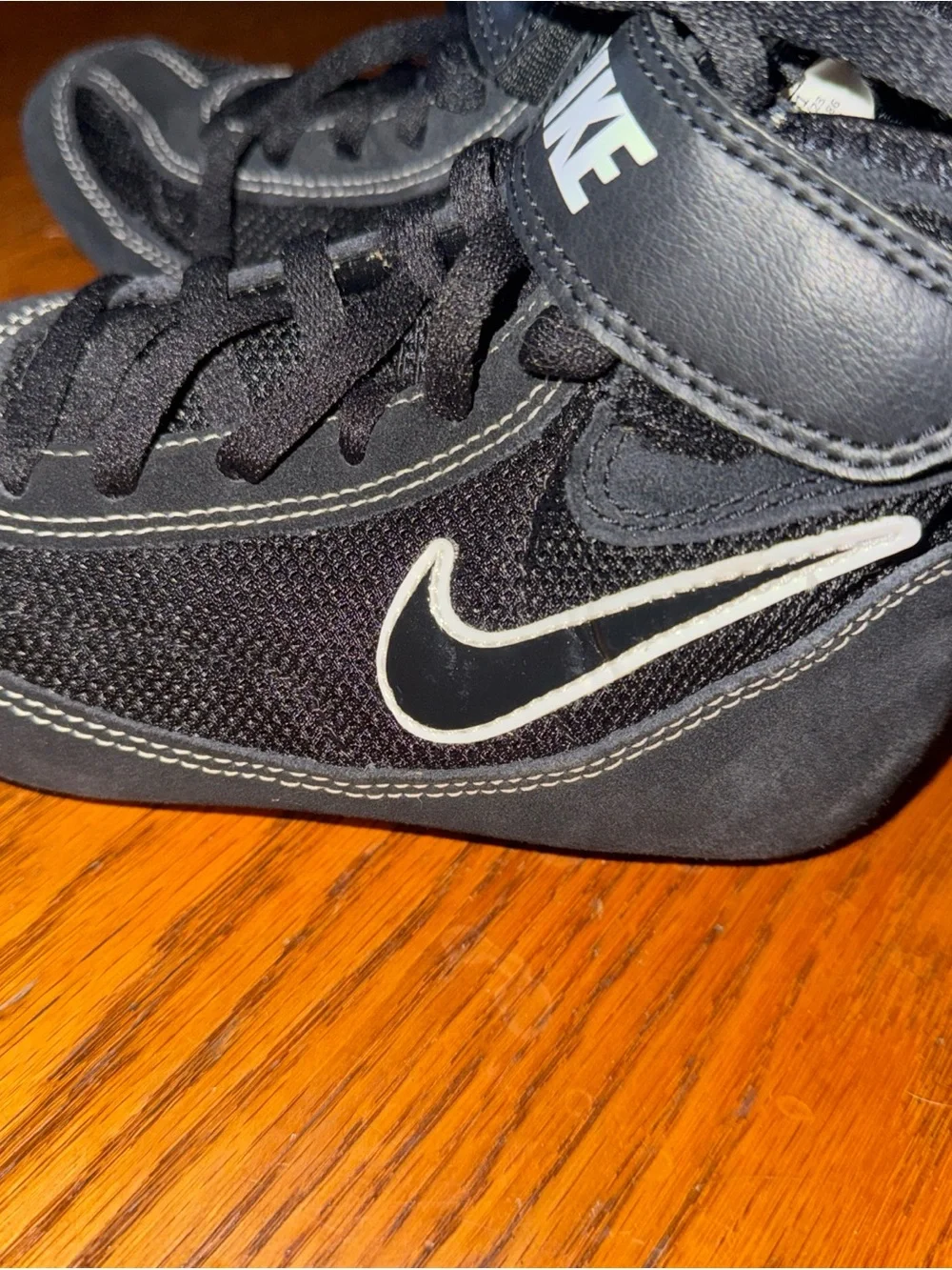 Nike Kids Black High-Top Sneakers with White Swoosh